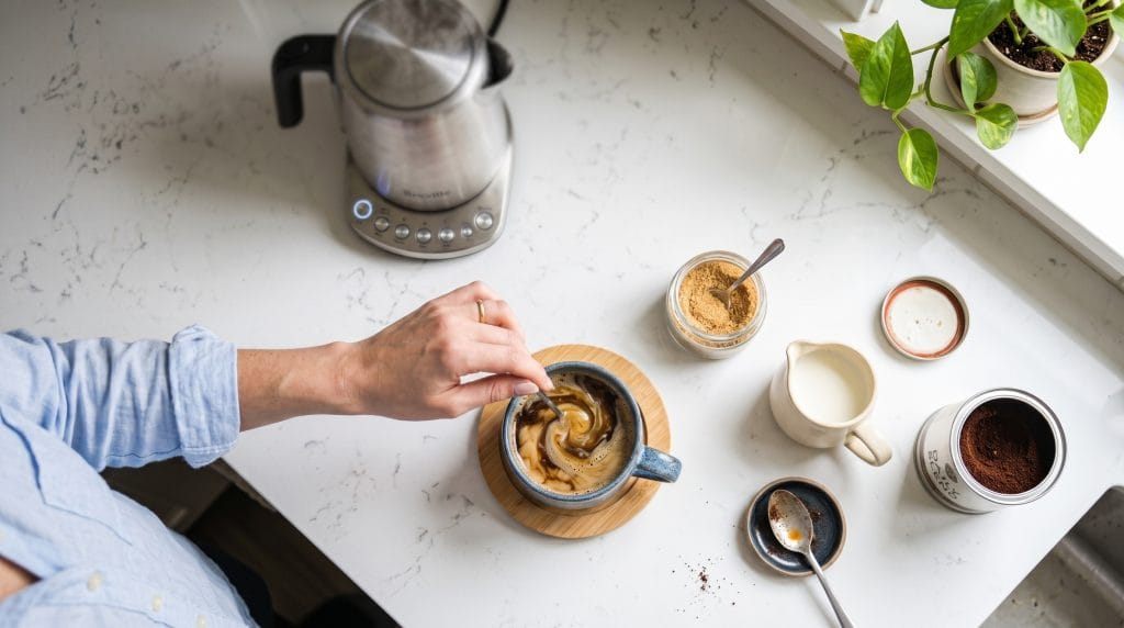 5-Minute Grounding Ritual: Easy Stress Reset Tea 6 Quick preparation of a warm grounding tea with a kettle slightly out of focus in a bright kitchen.